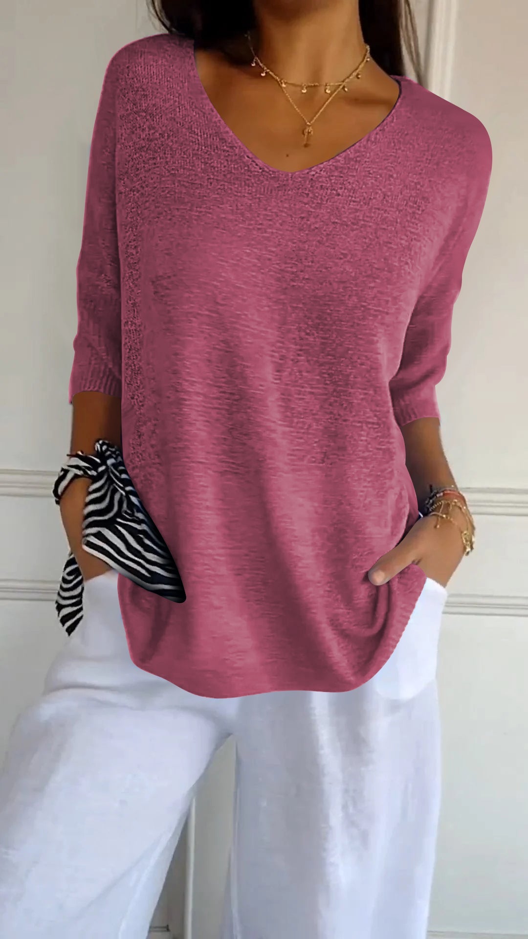 Top de punto de color liso con cuello de pico