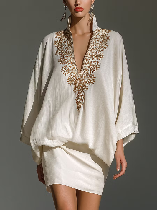 Conjunto elegante blanco con cuello en V y minifalda holgada