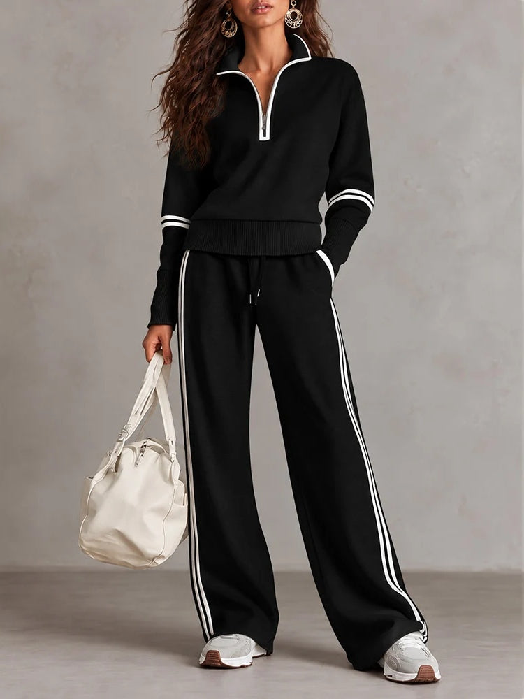 Conjunto blanco de sudadera de canalé con cuello alto y media cremallera y pantalones de pierna ancha con bloques de color