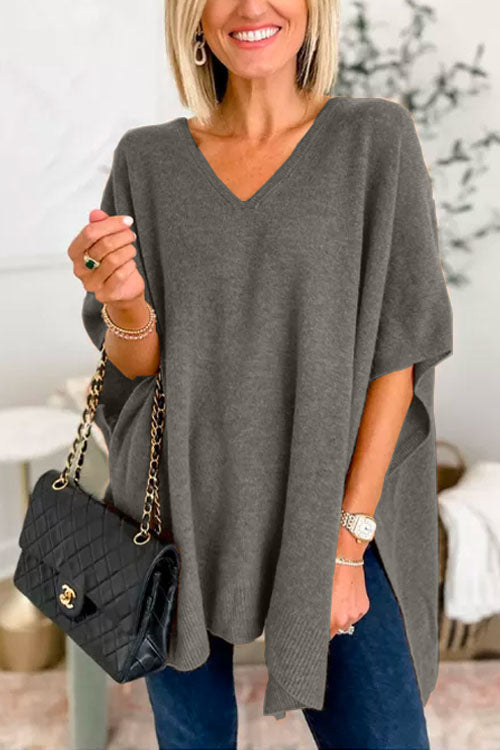 Suéter tipo poncho liso de corte holgado con cuello en V, muy elegante