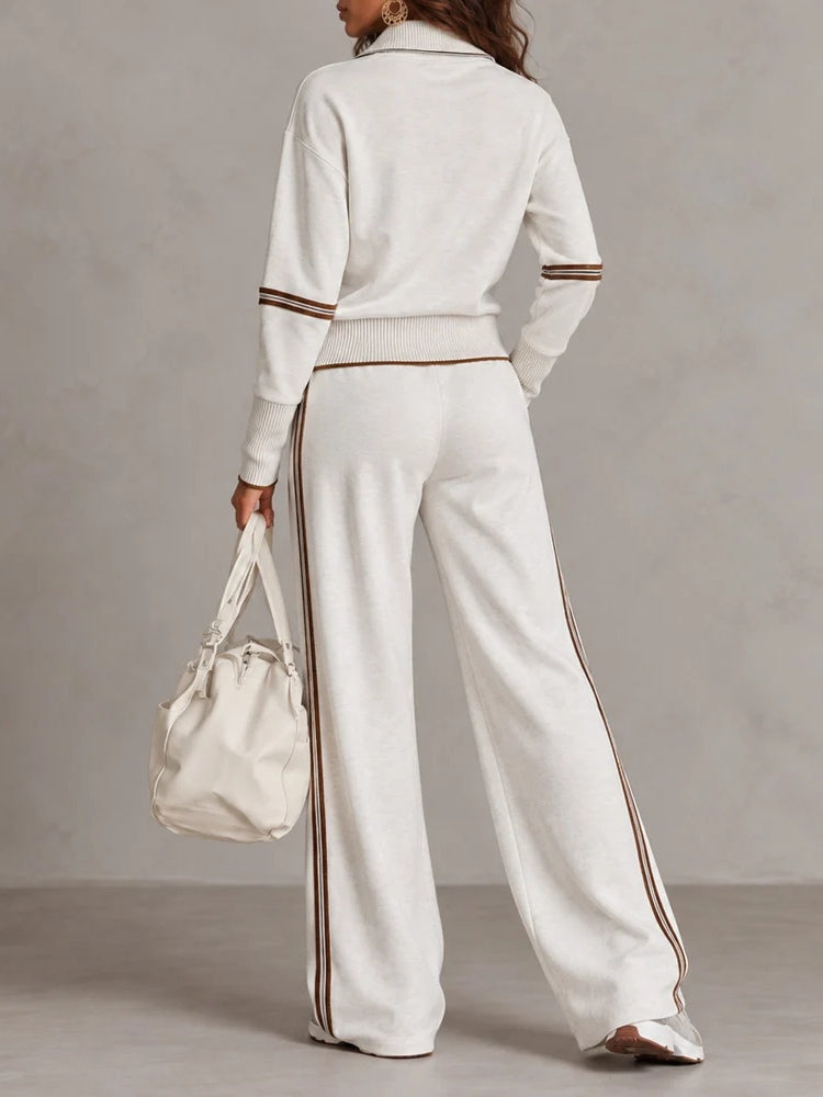 Conjunto blanco de sudadera de canalé con cuello alto y media cremallera y pantalones de pierna ancha con bloques de color
