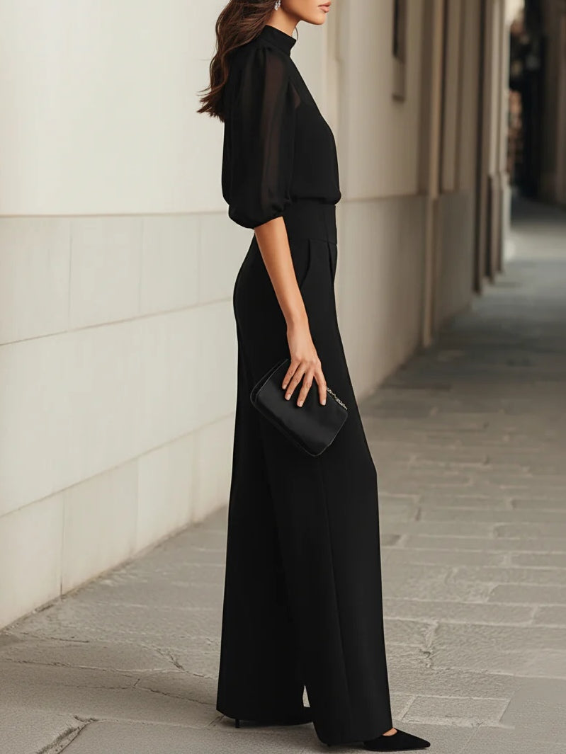 Conjunto de tres piezas con top de tirantes negro semitransparente y pantalones de pierna ancha