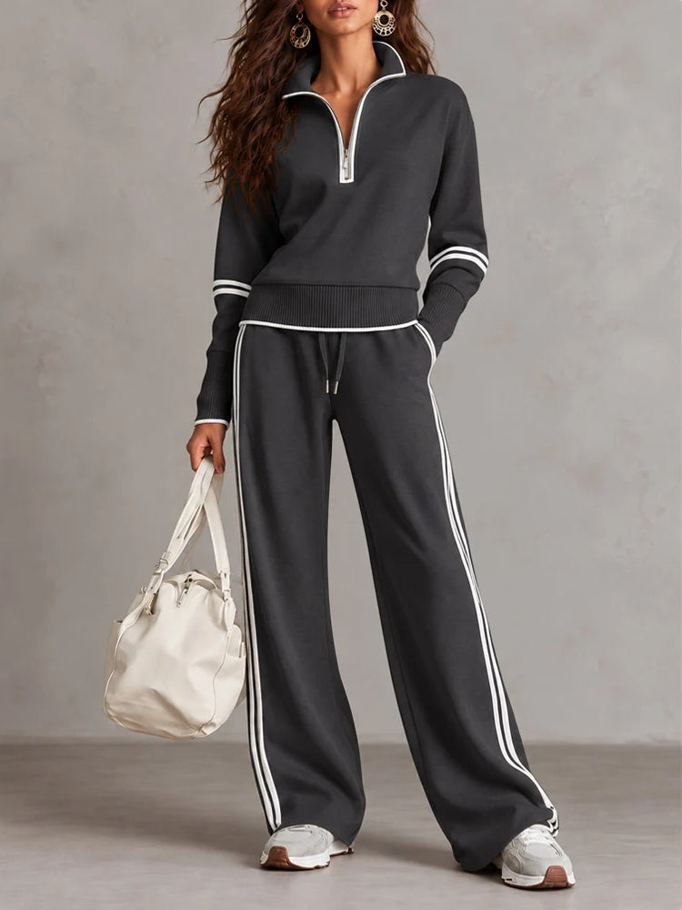Conjunto blanco de sudadera de canalé con cuello alto y media cremallera y pantalones de pierna ancha con bloques de color