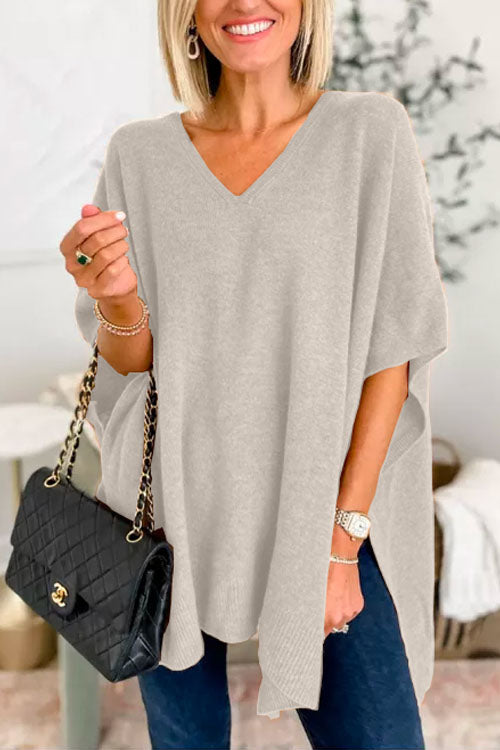 Suéter tipo poncho liso de corte holgado con cuello en V, muy elegante